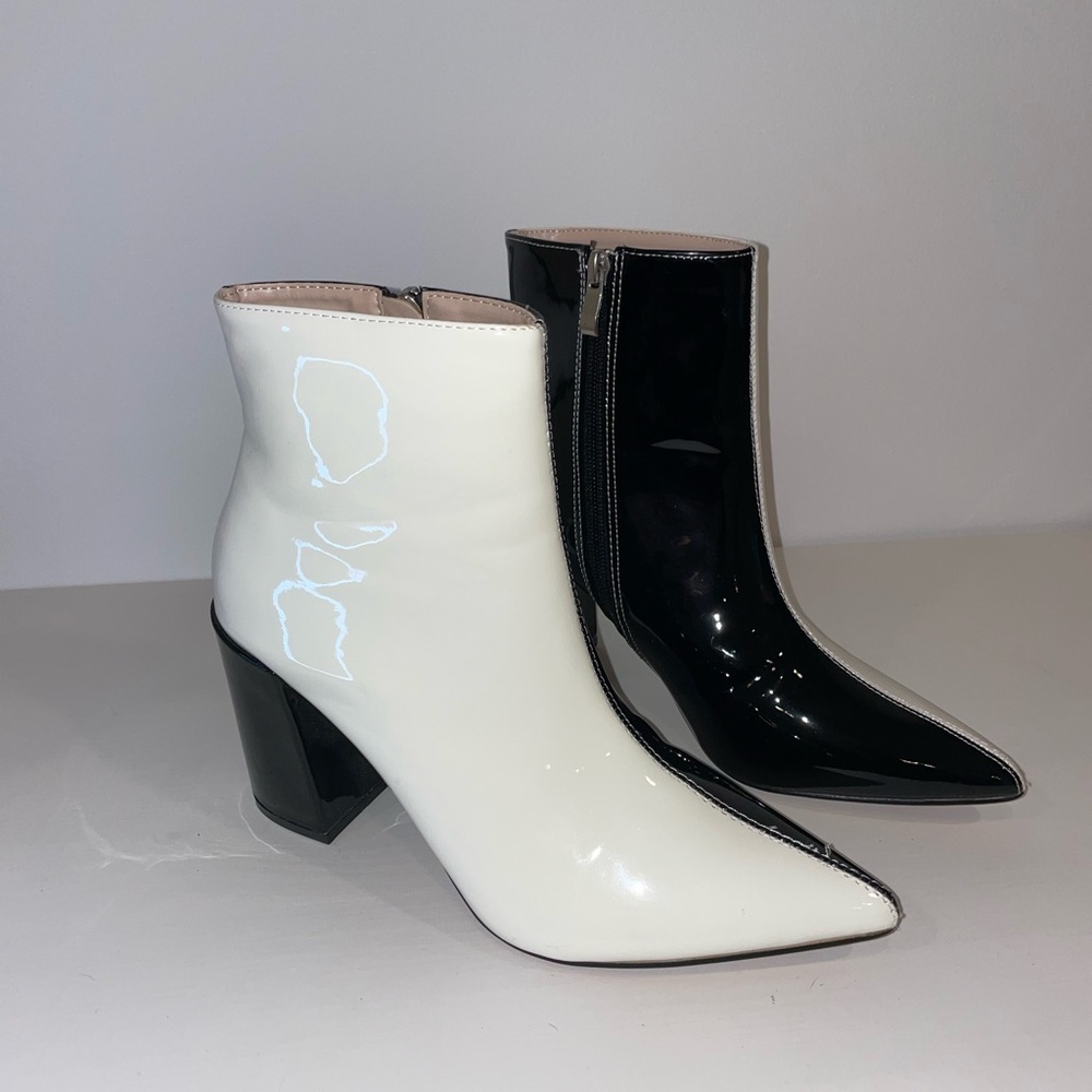 Never worn, brand new black and white booties,